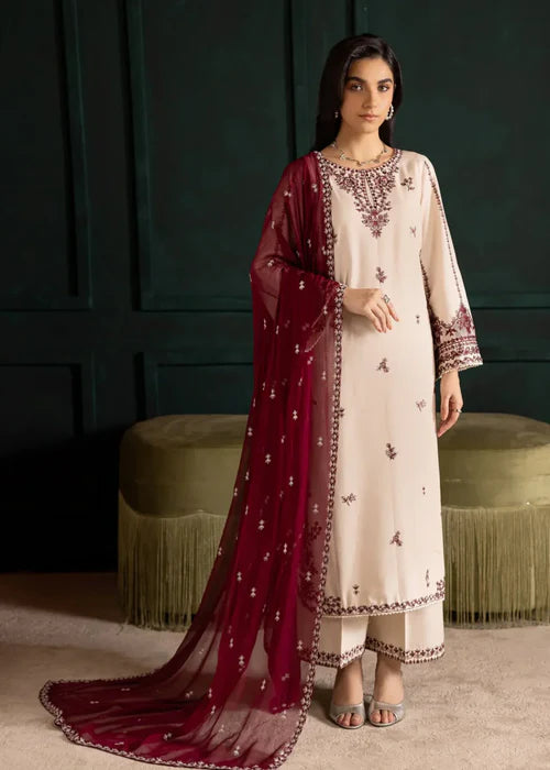 Model wearing Ivory Rua 3-piece embroidered luxury suit with dupatta by Afsura.
