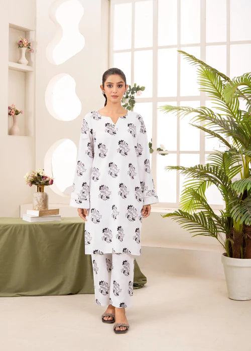 Model wearing Zeenat White 2-piece embroidered luxury suit by Afsura.