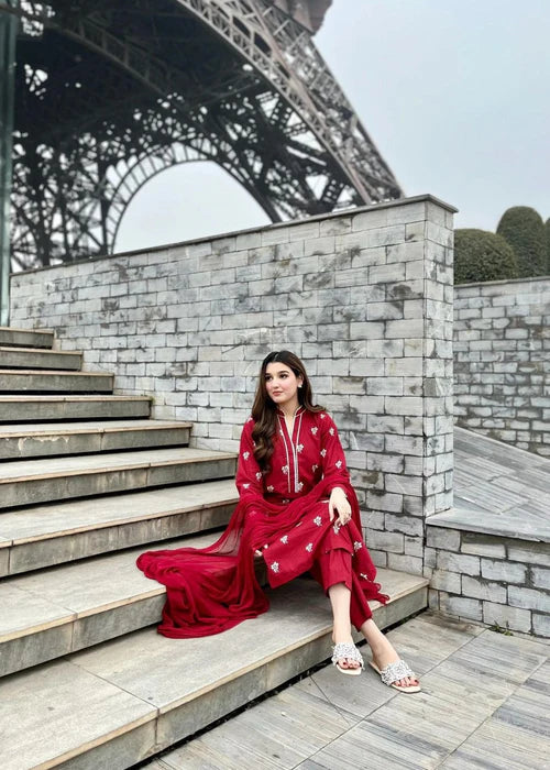 Close-up of delicate Lilly floral embroidery on the shirt neckline.