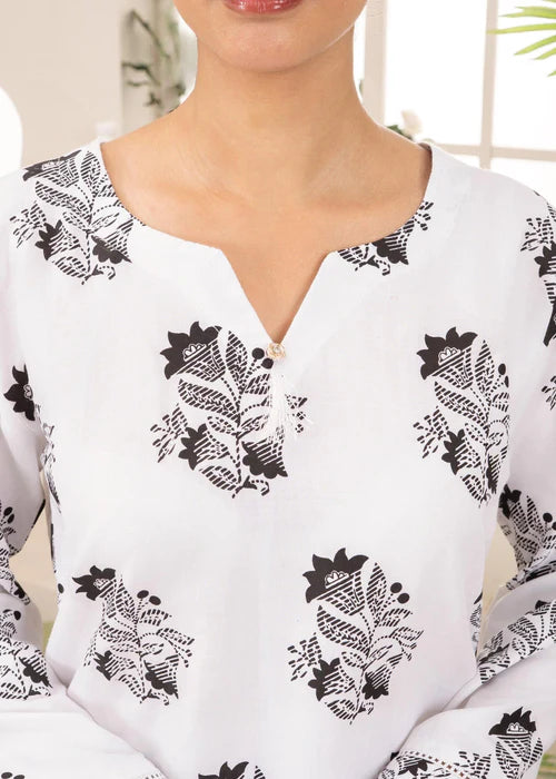 Close-up of white scalloped "Ringel" embroidery on a white Mandarin collar.