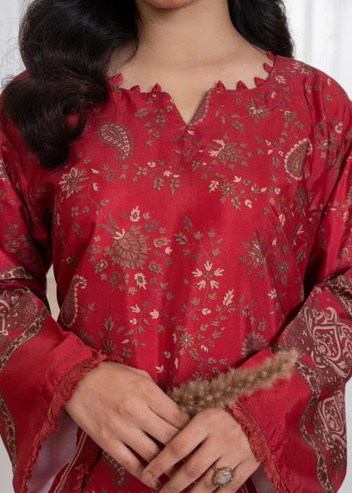 Close-up of ivory scalloped "Ringel" embroidery on a maroon Mandarin collar.