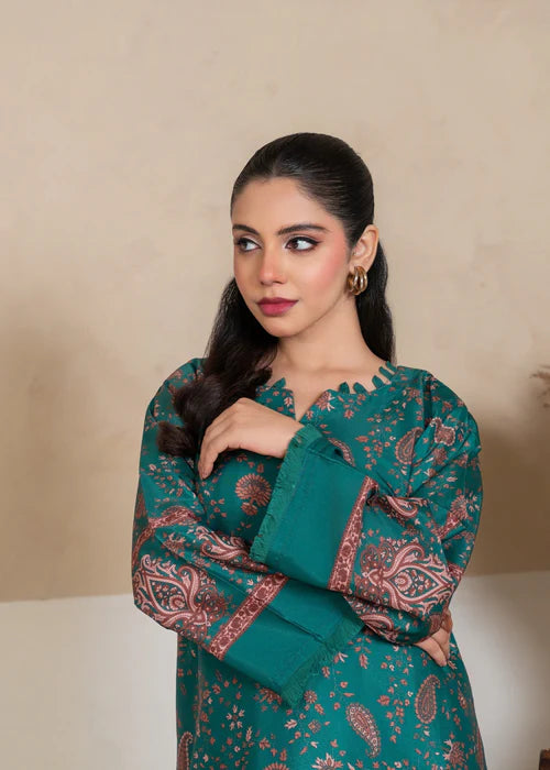 Close-up of intricate floral embroidery on the vibrant green neckline.